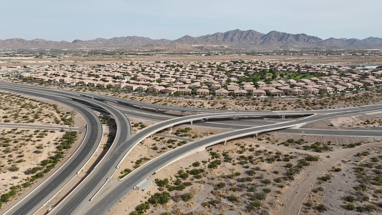I-215 Beltway interchange beside Aliante rooftops in North Las Vegas 89084